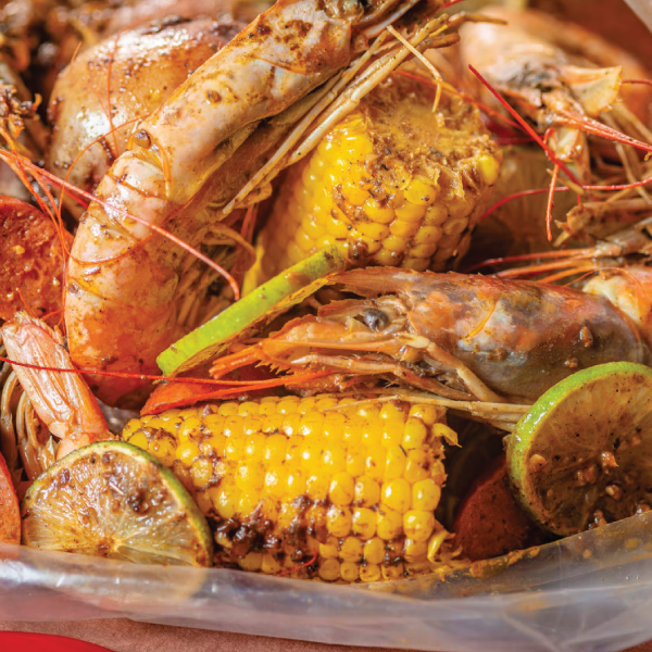 Mr. Crab boil with corn and shrimp and limes