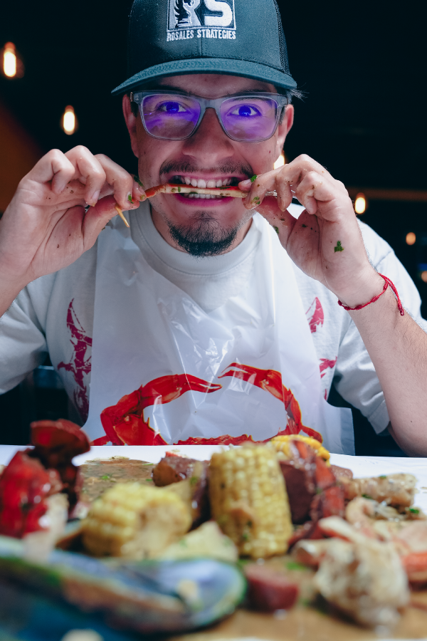 A customer eating AYCE at Mr. Crab