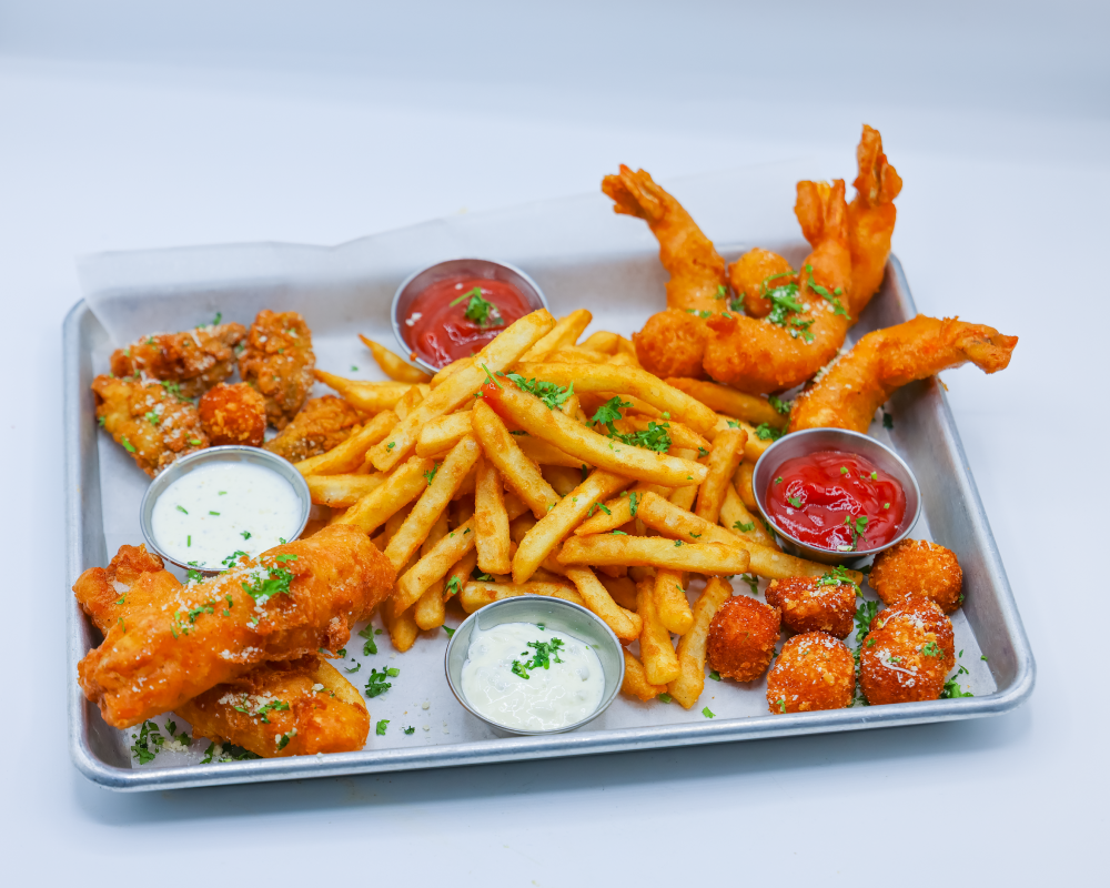 Freied Seafood platter served with fries, ranch, tartar sauce and ketchup